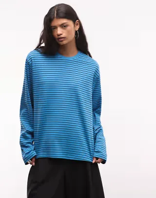 Weekday boxy oversized long sleeve top in black and blue stripes
