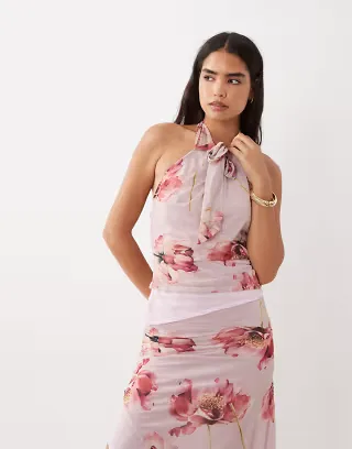ASOS DESIGN tied peek-a-boo hem halter top in pink floral
