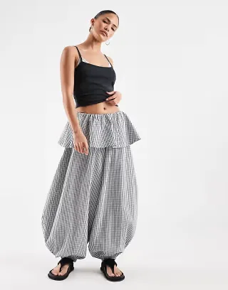 ASOS DESIGN Petite balloon pants with skirt overlay detail in black & white plaid