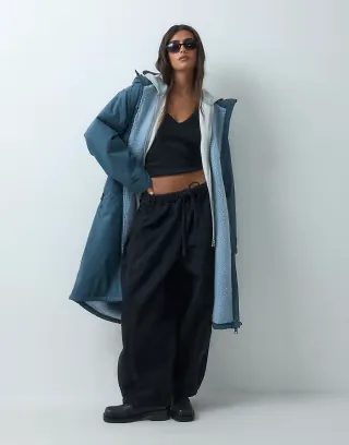 ASOS DESIGN longline rain coat in teal with blue borg liner