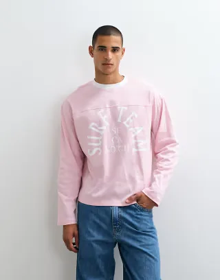ASOS DESIGN boxy oversized long sleeve t-shirt with surf team graphic in pink