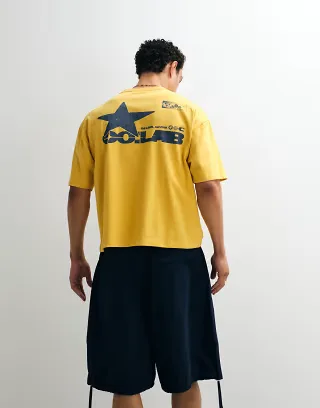 ASOS DESIGN oversized T-shirt with street graphic in yellow wash