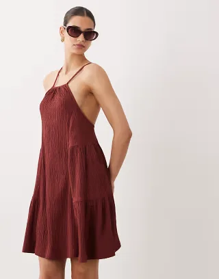 ASOS DESIGN textured halter trapeze mini dress in rust