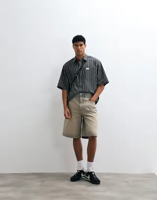 ASOS DESIGN oversized striped shirt with placket detail and badge in black