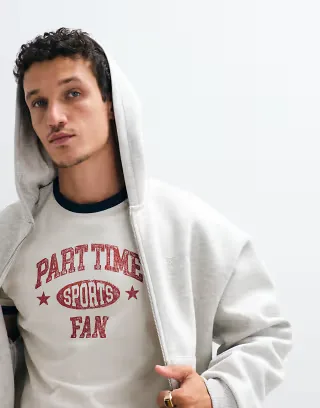 ASOS DESIGN boxy regular ringer T-shirt with sports slogan graphic in cream