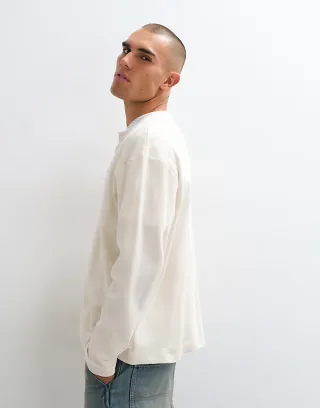Reclaimed Vintage long sleeve waffle knit henley neck t-shirt in cream