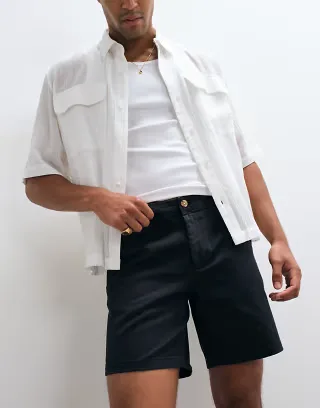 ASOS DESIGN slim fit chino shorts in mid length in black