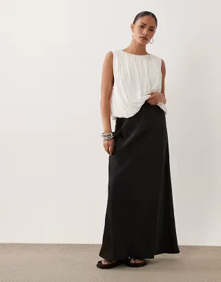 ASOS DESIGN Petite satin bias maxi skirt in black