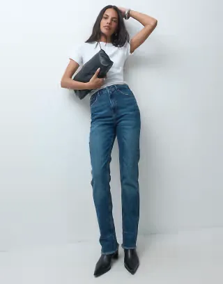 ASOS DESIGN high waisted pinch jean in vintage wash with raw hems