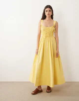 ASOS DESIGN ruched bodice maxi sundress with full skirt and multi stitched hem in yellow