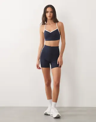 4505 active ruched front sports bra with contrast piping in deep navy