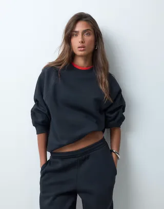 ASOS DESIGN regular raglan brushback sweatshirt in black