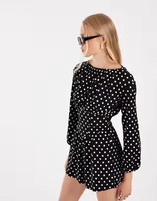 ASOS DESIGN polka dot cinched waist romper in black and white