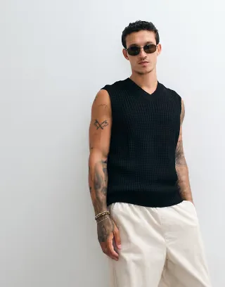 ASOS DESIGN relaxed textured waffle knit vest in black