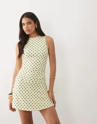 ASOS DESIGN sleeveless with peplum skirt mini dress in yellow polka dot print