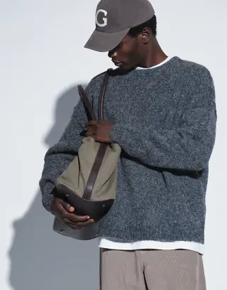 ASOS DESIGN relaxed knitted exposed crew neck sweater in charcoal