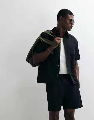 ASOS DESIGN textured shorts in mid length in black - part of a set