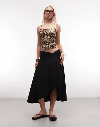 ASOS DESIGN jersey hanky hem skirt with button detail in black