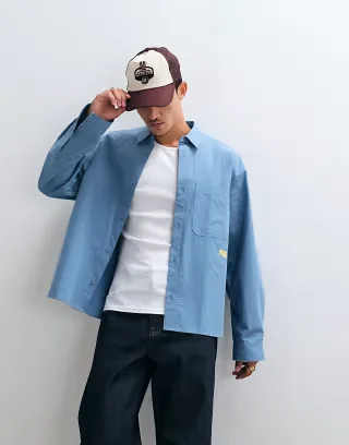 ASOS DESIGN oversized poplin shirt with chest embroidery in blue