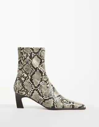 ASOS DESIGN Rudy chisel toe heeled sock boots in snake print