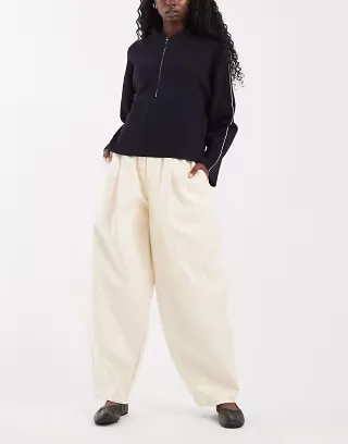ASOS DESIGN Tailored faux leather tapered pants in cream