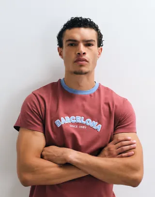 Reclaimed Vintage contrast ringer T-shirt with embroidered barcelona slogan in burgundy