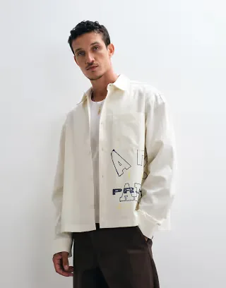 ASOS DESIGN boxy oversized poplin shirt with placement print in off white