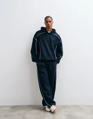 ASOS DESIGN extreme oversized hoodie and wide leg sweatpants set with white piping in navy