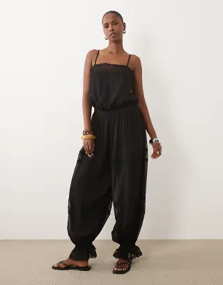 ASOS DESIGN sheer lace jumpsuit with bubble hem in black