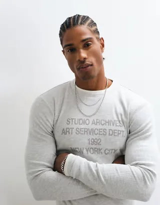 ASOS DESIGN muscle fit long sleeve ribbed crew neck in gray heather with graphic