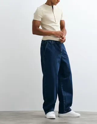 ASOS DESIGN loose straight leg jeans with elastic waist in mid wash blue