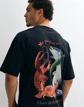 ASOS DESIGN oversized tee with Guinness print in Black