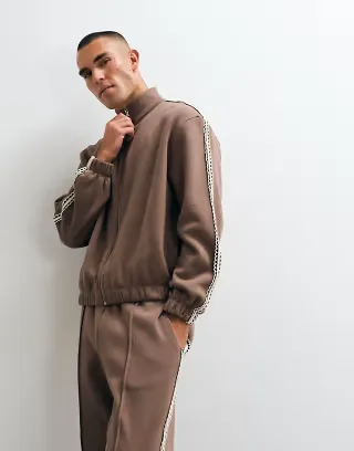 ASOS DESIGN relaxed boxy zip up jersey jacket with woven tape in brown