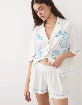 ASOS DESIGN textured jersey shorts with blue embroidery in cream - part of a set