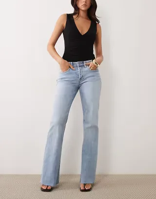 Good American vintage low waist relaxed flare leg jeans in light blue wash