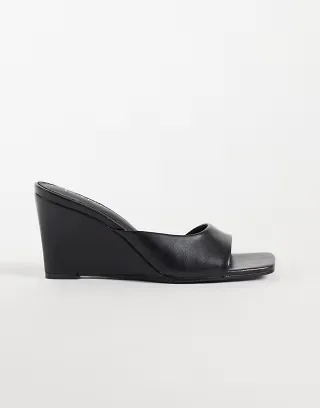 RAID Juniper wedge heeled mules in black