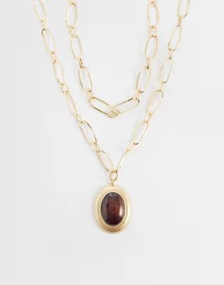 ASOS DESIGN multi-row necklace with large burgundy resin pendant in gold tone