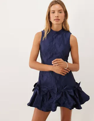 Sister Jane exclusive jacquard sleeveless cinched waist bow hem mini dress in navy