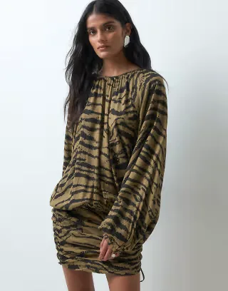 ASOS DESIGN crew neck mini dress with gathered skirt detail in animal print