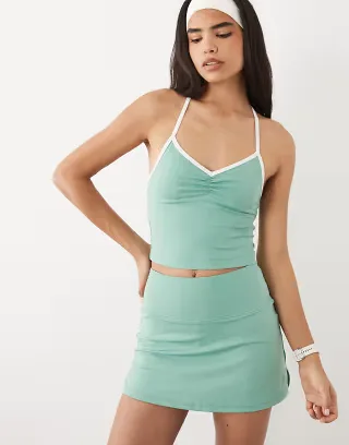 4505 active ruched front tank top with inner bra and contrast piping in mint