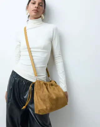 ASOS DESIGN hair on leather drawstring pouch clutch bag with detachable strap in chartreuse