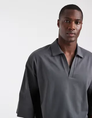 ASOS DESIGN heavyweight boxy oversized polo shirt with half sleeves in charcoal